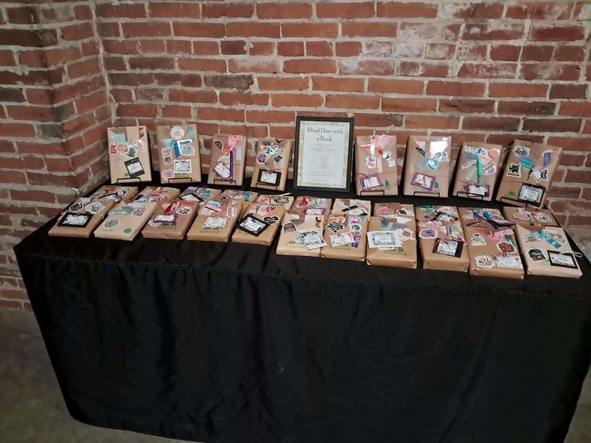 The Secret Shelf pop-up table filled with wrapped Blind Date with a Book bundles